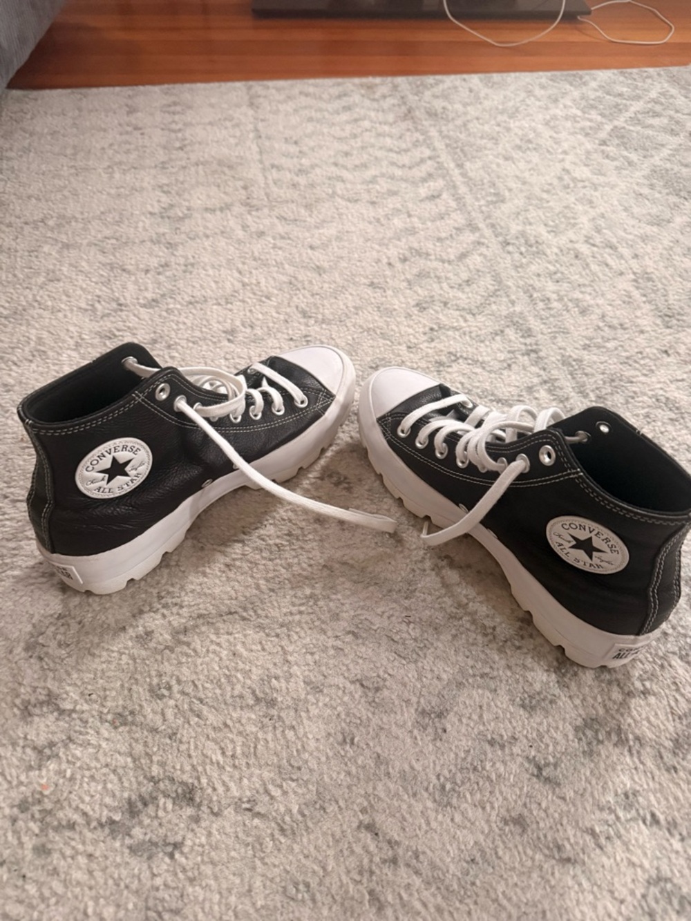 Converse women’s leather Black and White High-Top Platform Sneakers